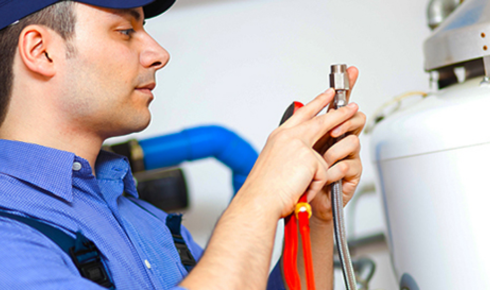 How can scheduling regular servicing for the geyser prevent sudden breakdowns in winter