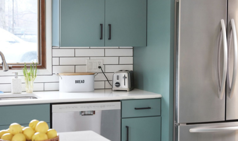 Why is it useful to decide appliance positions before finalising power point locations in a remodelled kitchen